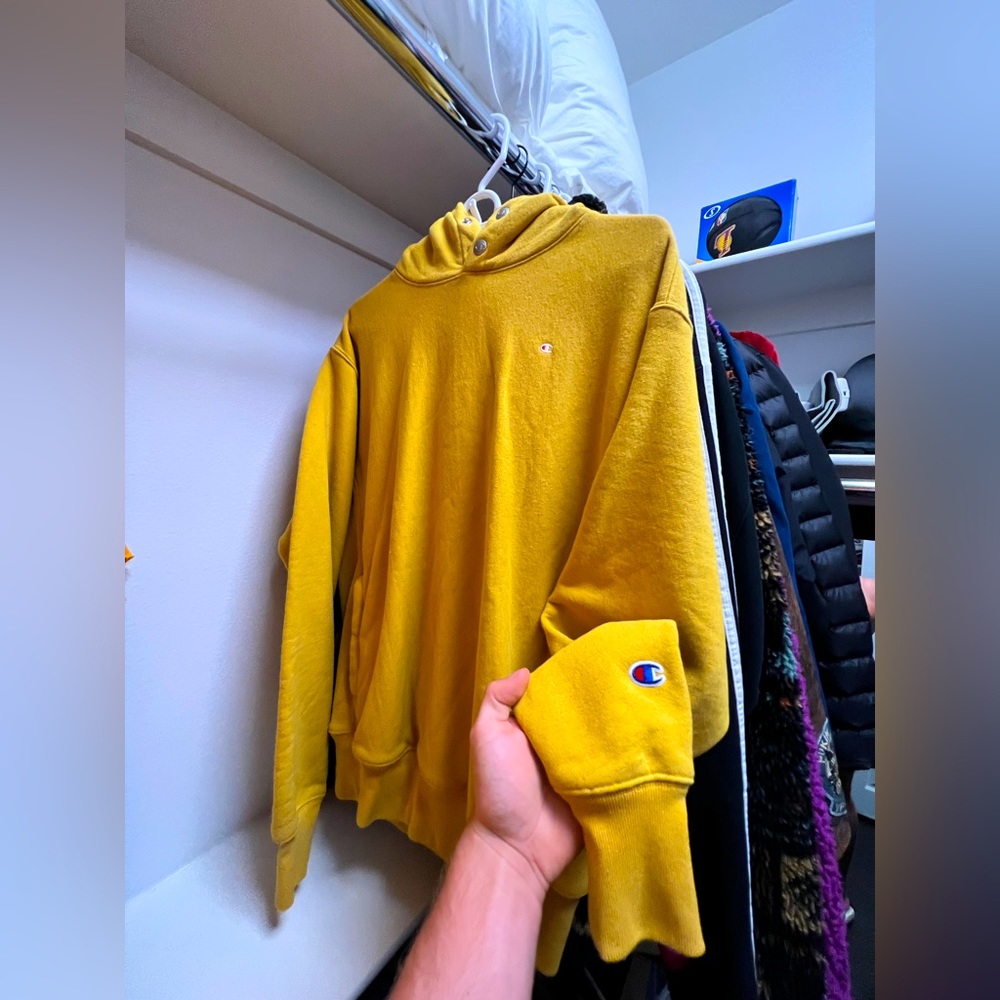 Champion Hoodie that has the color of honey mustard coming in a size Medium.